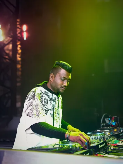 In the zone during a set. Mastering the art of DJing is about focus and precision, and I'll guide you through every technique, from basic beatmatching to advanced mixing, right here in Bangalore.