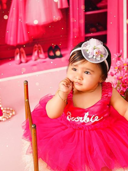 A thoughtful moment in the Barbie dream house. The all-pink set and detailed props make this a truly immersive and fun experience.