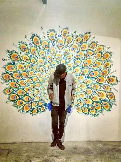 Flex! This peacock feather mural at Le Terrace in Nagarbhavi is another one of our selfie walls. The vibrant colors and fanned out design create a stunning backdrop for photos.