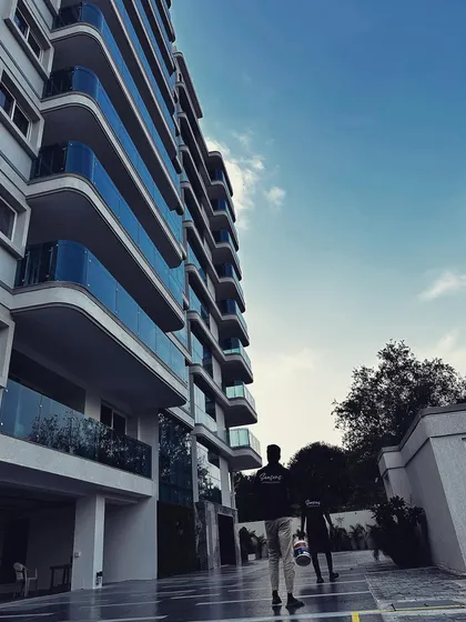 Making concrete jungles bloom. This image captures our team arriving at the Sankalp apartment complex, ready to provide the garden maintenance that keeps this large residential space green and beautiful.