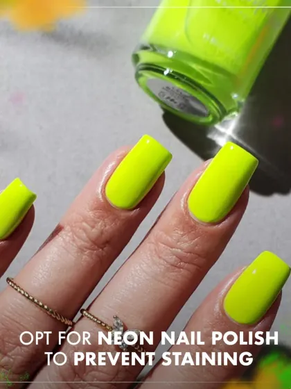 Make a bold statement with neon nail polish. A bright color like this neon yellow not only looks fun and trendy but can also help prevent deep staining from Holi colors.