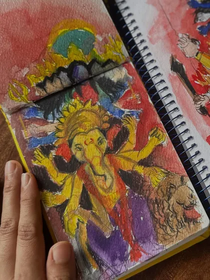 A close-up of my watercolour sketch of Ganpati, showing the texture of the paper and the flow of the colours. This was painted live during a visit to a local pandal.