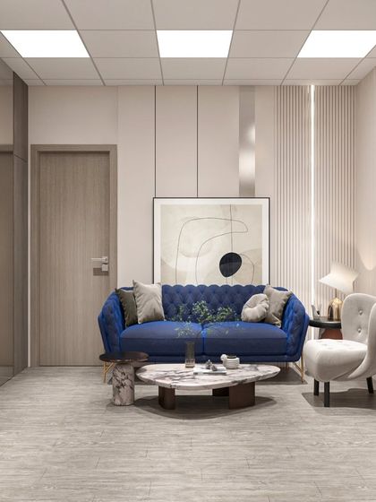 A waiting area in the Neemrana office, where a bold blue sofa adds a pop of color that reflects the brand's logo, creating a cool and trustworthy vibe.