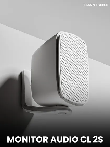 A close-up of the sleek Monitor Audio CL 2S wall-mounted speaker. Its minimalist design and durable construction make it a perfect choice for modern outdoor spaces where both aesthetics and all-weather performance are crucial.