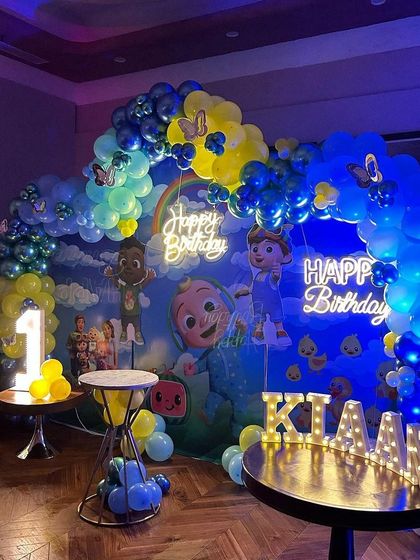 The full Cocomelon party scene for Kiaan, showing how all the elements, including the light-up name, come together to create an impressive and festive environment.