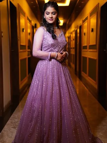 A beautiful portrait of the engagement bride. The lighting perfectly captures the shimmer in her makeup and the elegance of her gown.