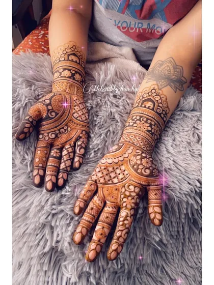 The back of the hands, showing how the intricate patterns continue from the front for a complete look.
