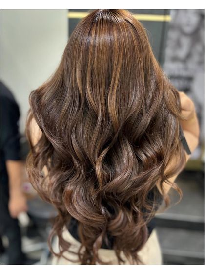 A close-up of the same balayage, showing the intricate blend of light and dark brown tones that create so much dimension.