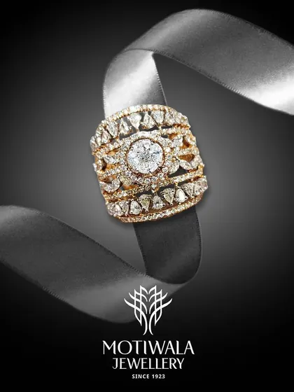 An ornate, multi-layered diamond ring wrapped around a silk ribbon, showcasing its intricate craftsmanship and luxurious feel.