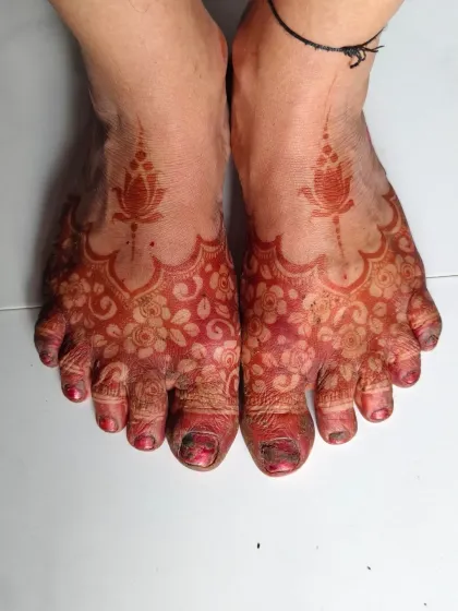 The beautiful, rich stain of the foot mehndi after the paste has been removed.