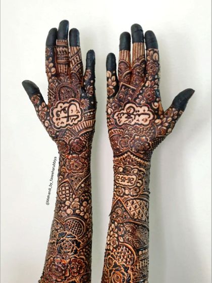 Simran's full bridal henna, featuring personalized name designs and the wedding date incorporated into the artwork.