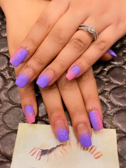 A vibrant and fun ombre on coffin-shaped nails. This set features a bold gradient from a bright pink base to a rich purple at the tips.