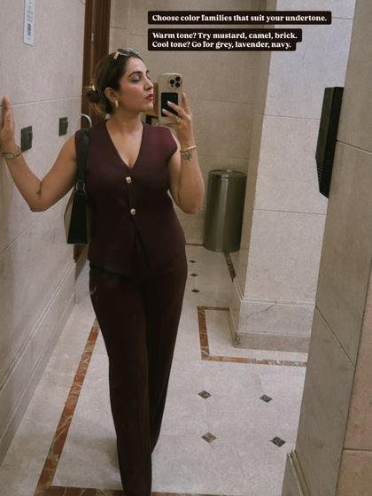 A pro tip for monochromatic styling: choose color families that suit your skin's undertone. For my warm undertone, shades like mustard and brick work well. For cool tones, try grey or navy.