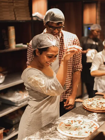 Another shot of our Parm Queen, smiling and enjoying her work in our open kitchen.
