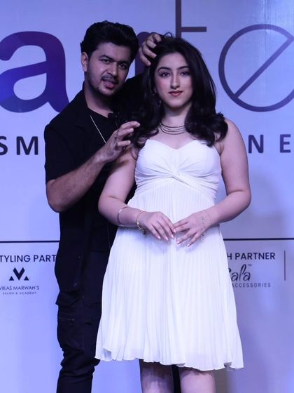 Posing with a model after completing her look on stage. It's a great feeling to see the final creation come to life.