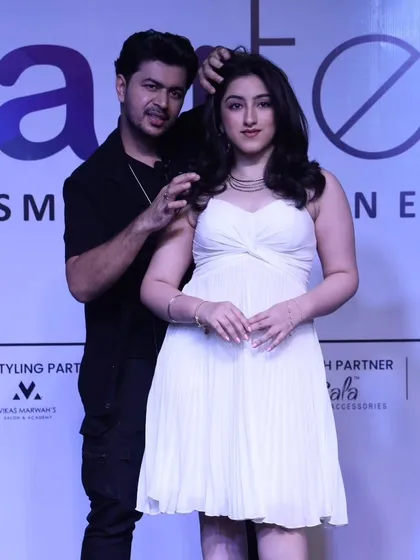 Posing with a model after completing her look on stage. It's a great feeling to see the final creation come to life.