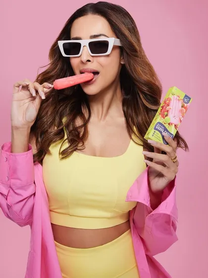 Fun and vibrant hair for a fun and vibrant shoot with Malaika Arora. The bright lighting highlights the warm tones in her hair, styled for a casual and playful look.