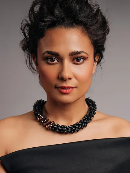 A studio portrait for Lorettidesign jewelry, shot in Aruba. The goal was clean, direct lighting to highlight the intricate details of the necklace. Post-production was done in Lightroom using Elinchrom lights.