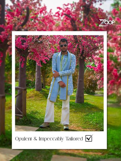 Opulent and impeccably tailored. This light blue kurta set from the Jazbaat collection, worn in a beautiful garden setting, is the epitome of festive elegance.