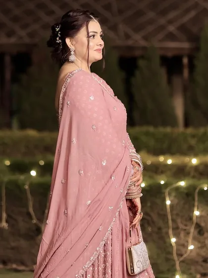 Another beautiful shot of this timeless party look. The makeup enhances her features without looking heavy.