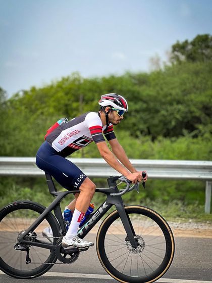 An elite rider on a Trek Madone, a top-of-the-line race bike.