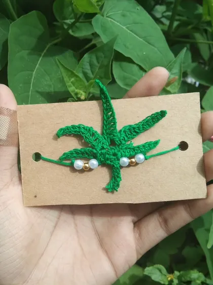 A custom-ordered weed or marijuana leaf rakhi, for a bit of fun.