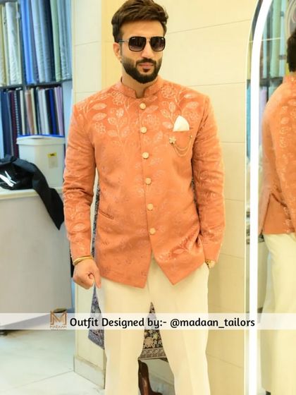 A client looking sharp in our peach-colored Jodhpuri blazer. The jacket features self-colored floral embroidery, offering a subtle yet sophisticated look.