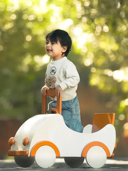 The pure, unfiltered joy of childhood. This outdoor lifestyle session captures a little adventurer's happy smile, bathed in beautiful natural sunlight. These candid shots are all about letting kids be kids and preserving their genuine spirit.