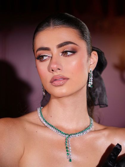 A soft, elegant portrait that captures the luminous quality of the makeup.