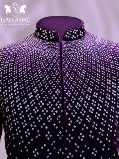 A close-up of the collar and shoulder of the purple velvet Jodhpuri, where the intricate silver beadwork is most concentrated.