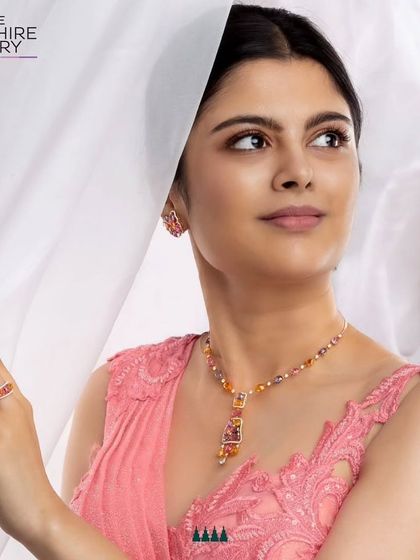 Styling for a multi-sapphire jewelry collection. I chose a delicate pink gown to complement the vibrant pink, orange, and yellow tones in the necklace and earrings, creating a harmonious and beautiful look.