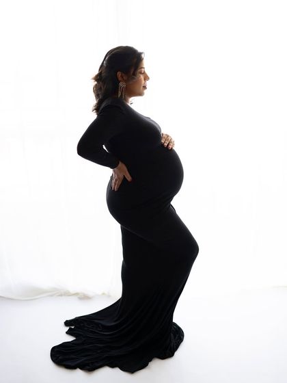 Another angle of this stunning silhouette. The side profile against the bright window creates a timeless black and white feel that is simply breathtaking.
