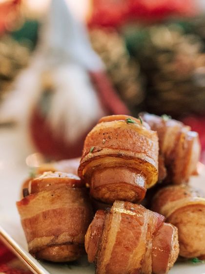 A festive favorite: pigs in a blanket. These savory bites are a classic addition to our Christmas and Thanksgiving menus, loved by guests of all ages.