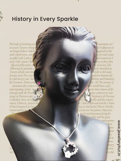 A beautiful floral pendant and earring set displayed on a mannequin, showcasing our heritage-inspired designs.