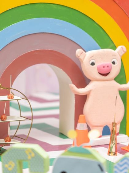 Every detail in a Cocomelon party is about bringing joy and color. This cute pig character, set against a rainbow arch, was one of the many elements that made the kids feel like they had stepped right into their favorite show.