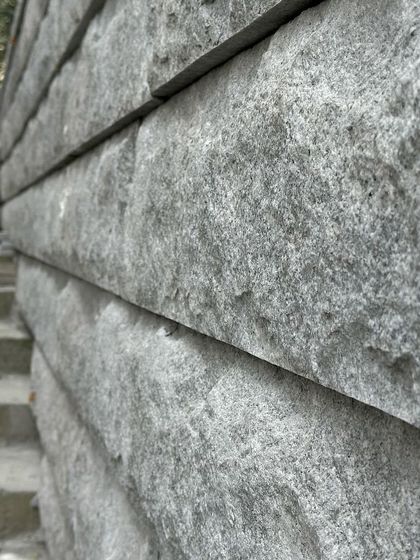 Another detail of the stacked stone, showing the rough, natural face of the material. We celebrate this honesty in our work.
