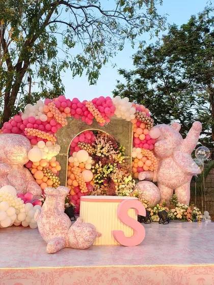 A truly unique teddy bear theme featuring large bear sculptures made entirely of balloons. This impressive display of balloon artistry, set on a custom stage, creates a one-of-a-kind centerpiece for a very special celebration.