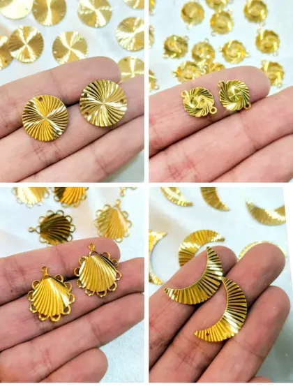 This image displays more of our brass jewelry findings, including textured discs and crescent moon charms. These components are perfect for adding detail and movement to your earrings and necklaces.