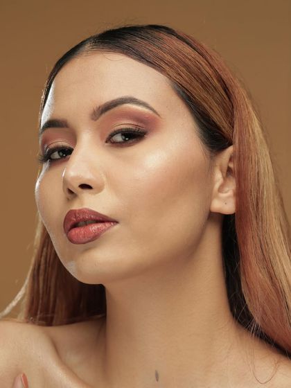 A simple and elegant makeup look I created for a photoshoot. The focus is on soft, blended eyeshadow and a defined lip to enhance the model's natural beauty.