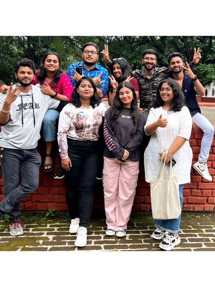 The whole crew posing on a brick wall at Aga Khan Palace. The grounds were beautiful to explore.