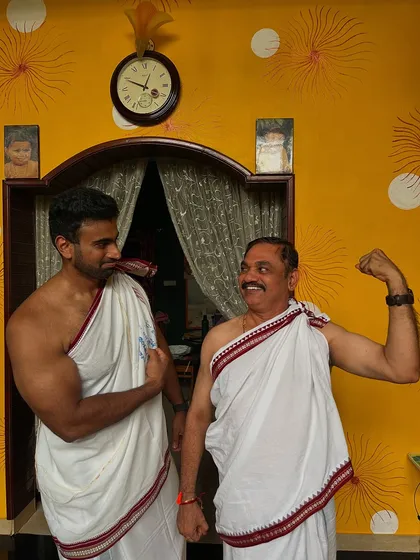 A fun moment with my father, flexing after the ceremony. Fitness and strength can be a part of every aspect of life.