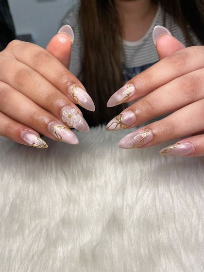 A full view of the pink cat eye and gold chrome set, showcasing the intricate details.