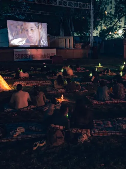 Watching a classic film on a massive screen surrounded by greenery and soft lighting. This setup at SCC Republic in Pune shows how we blend nature with cinema for a truly memorable night.