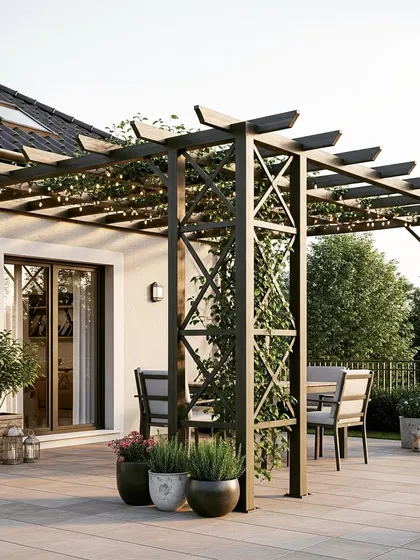 A rustic-industrial style pergola with a metal frame featuring decorative cross-bracing. The structure is softened with climbing plants and surrounded by potted herbs and flowers on a stone patio.