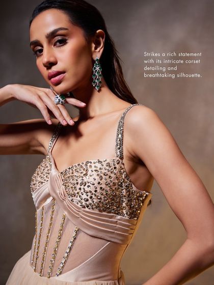 This close-up of the Bella Gown highlights the rich statement of its intricate corset detailing, designed to create a striking and confident look.