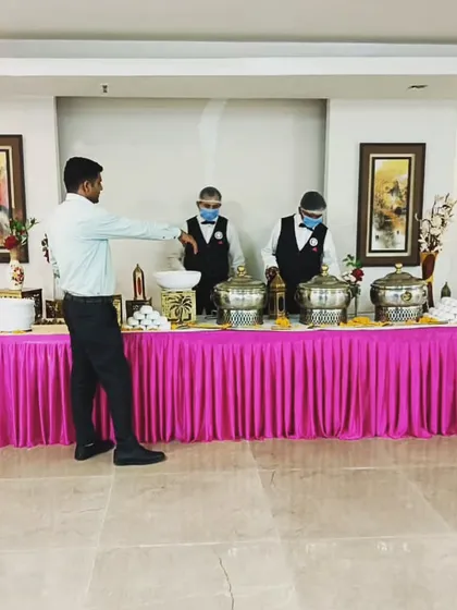 My supervisor, Mr. Sunil Kumar, overseeing the buffet setup with the service staff. I personally ensure that a senior team member is always on-site to guarantee quality.