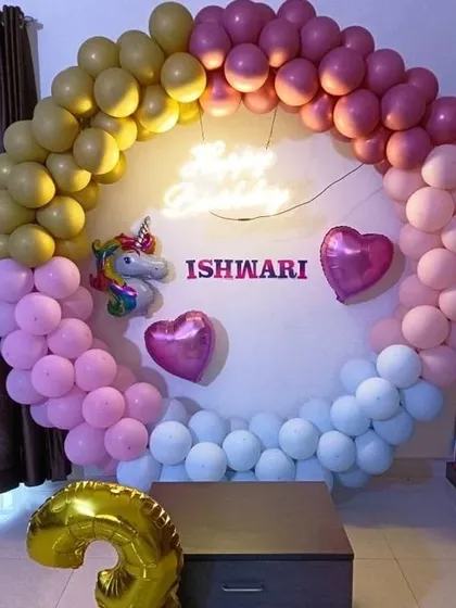 A simple yet sweet home decoration with a multi-colored balloon ring, unicorn and heart foil balloons, and a large number '3'.