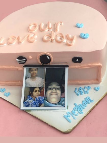 Say cheese! This unique camera-shaped cake features a pull-out strip of edible photos, making it a wonderfully personal and interactive gift for a loved one.