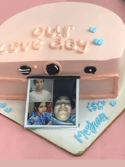 Say cheese! This unique camera-shaped cake features a pull-out strip of edible photos, making it a wonderfully personal and interactive gift for a loved one.