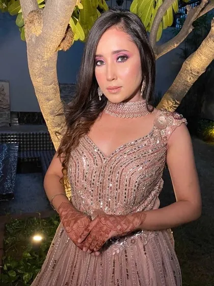 This client is ready for an engagement or cocktail party in our shimmering blush pink gown. The delicate sequin work and matching choker make for a glamorous and modern rental choice.